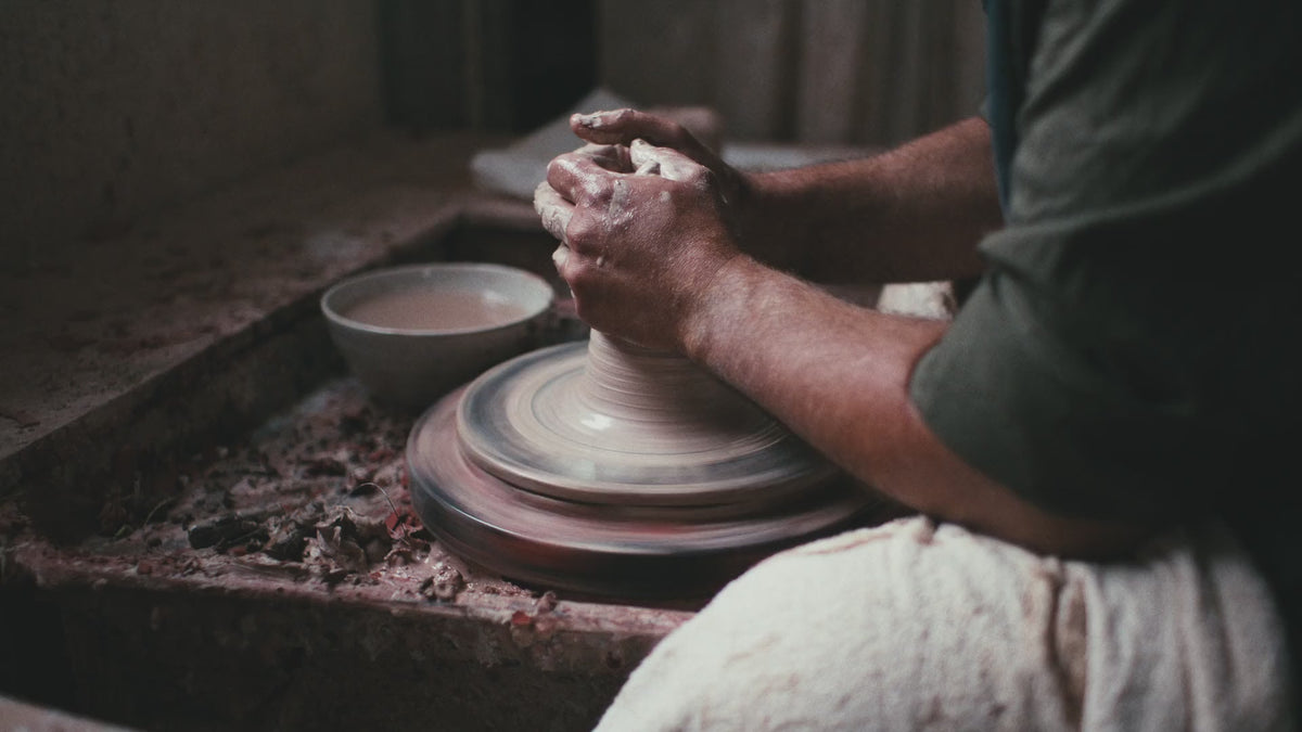 A video of the Davidoff family working in their pottery studio, wearing Driza-Bone vests and jackets.